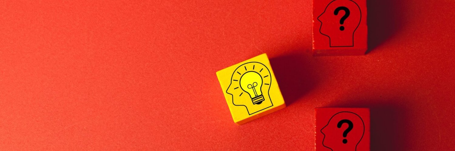 A,Yellow,Wooden,Block,With,A,Lightbulb,Idea,Icon,Stands